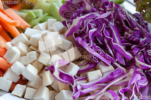Image of raw food from red cabbage, celery, carrots