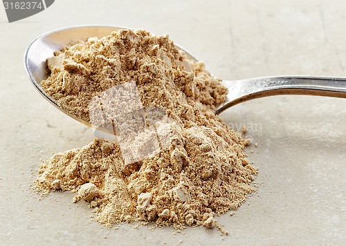 Image of spoon of maca powder