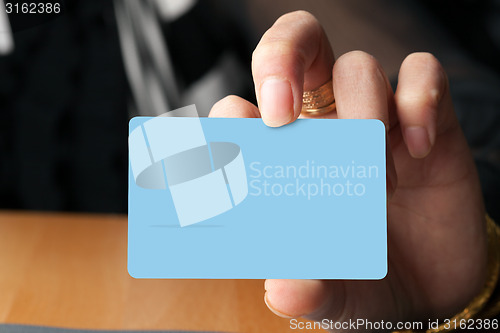 Image of Hand Holding a Card