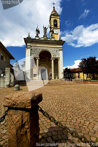 Image of cairate in  the old   church  closed brick tower sidewalk 