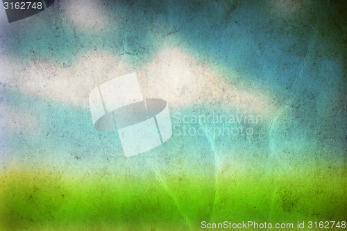 Image of Conceptual green grass and sky old paper