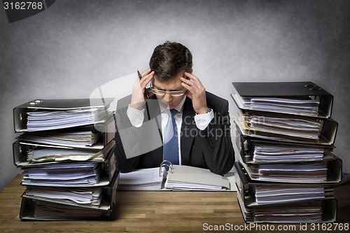 Image of Overworked businessman