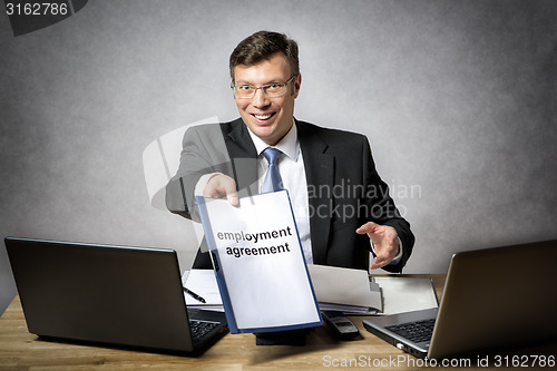Image of Boss gives employment agreement