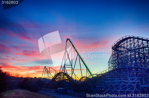 Image of curves of a roller Coaster at Sunset or sunrise