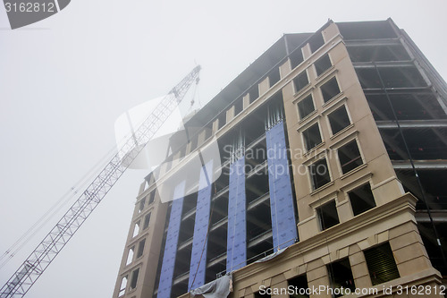 Image of foggy day over major construction site 