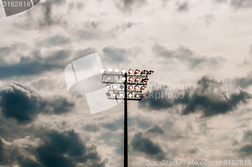 Image of Stadium lights turn on at twilight time