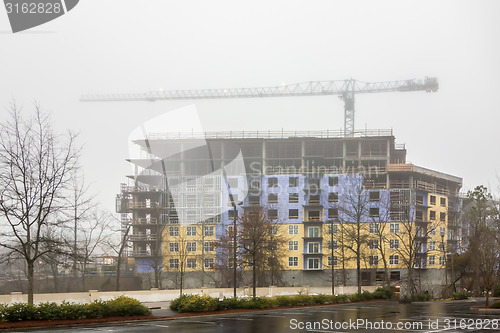 Image of foggy day over major construction site 