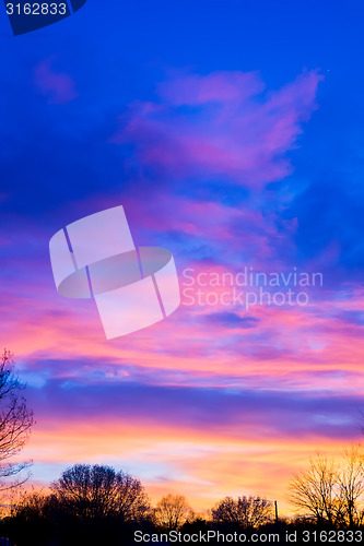 Image of sunset over farm field landscape