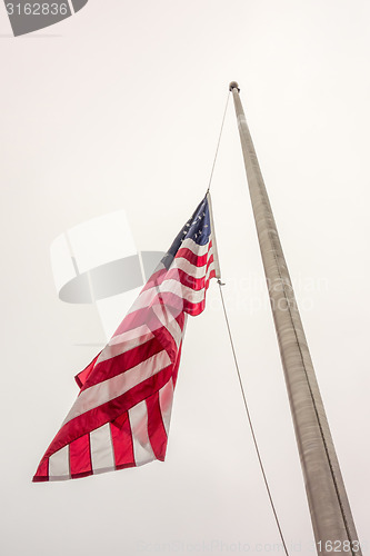 Image of Half mast American flag concept as a symbol of the United States