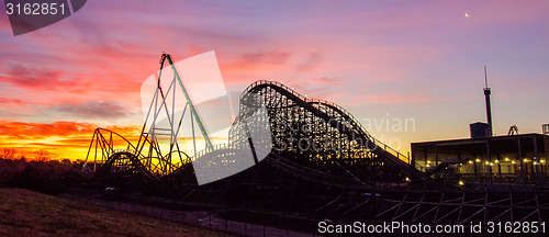 Image of curves of a roller Coaster at Sunset or sunrise