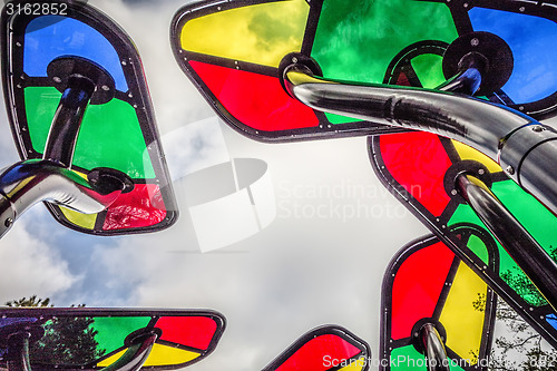 Image of colorful playground structure elements with sky