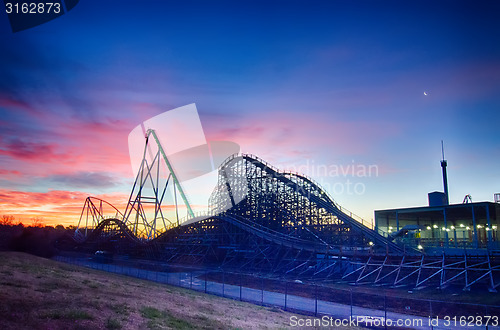 Image of curves of a roller Coaster at Sunset or sunrise