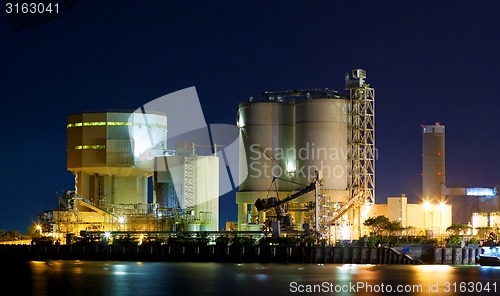 Image of power station at night with smoke