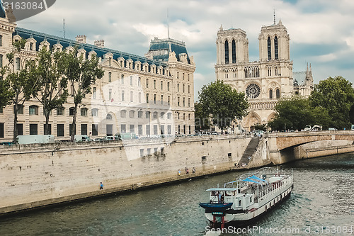 Image of Notre Dame  with boat on Seine, France