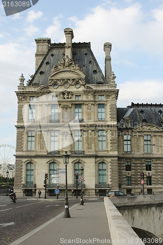 Image of France, Paris - June 17, 2011: People walking in front of famous Louvre museum 