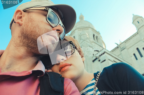 Image of couple on a background of Basilica of the Sacre Coeur