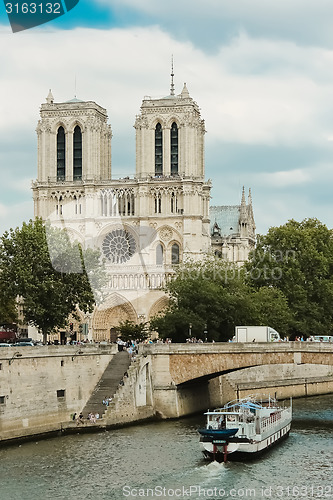 Image of Notre Dame  with boat on Seine, France