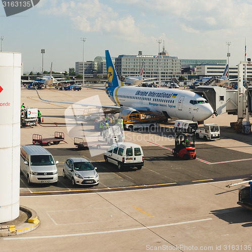 Image of France, Paris - June 17, 2011:  Boeing connected to passenger boarding bridge at Charles de Gaulle Airport. Air France is the French flag carrier headquartered in Tremblay-en-France.