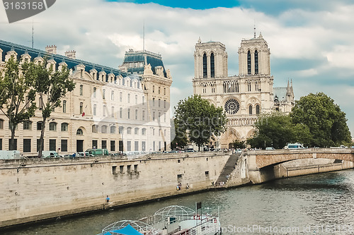 Image of Notre Dame  with boat on Seine, France