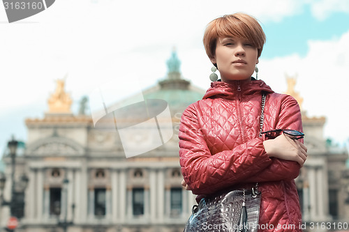 Image of blonde woman portrait in front of Opera theater Paris, France.