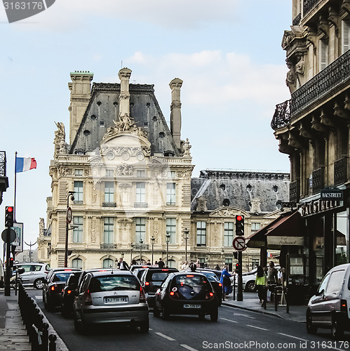 Image of France, Paris - June 17, 2011: People walking in front of famous Louvre museum 
