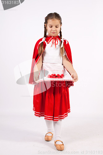 Image of little girl in costume looking into the distance