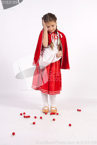 Image of little girl in costume looking into the distance