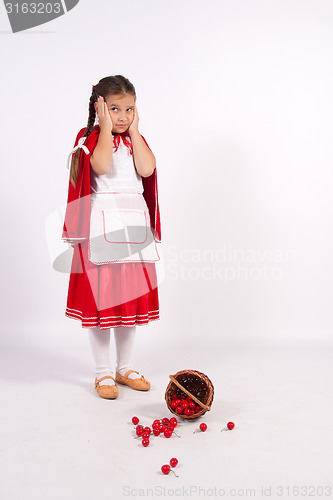 Image of little girl in costume looking into the distance