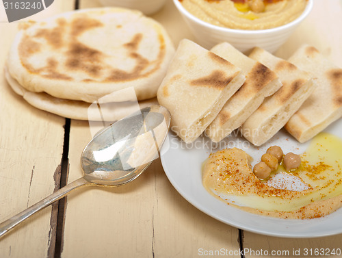 Image of Hummus with pita bread 