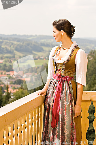 Image of Bavarian girl on the balcony