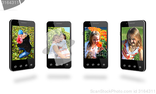 Image of four smart-phones with colored images isolated