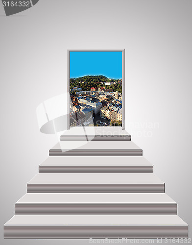 Image of stairs leading up to landscape of city