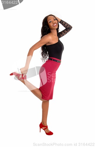 Image of Black woman dancing on floor.