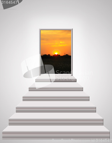 Image of stairs leading up to landscape of sunset