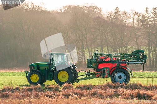 Image of Tractor on a field with ferilizer