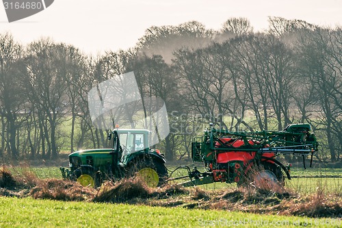 Image of Tractor with fertilizer on a field