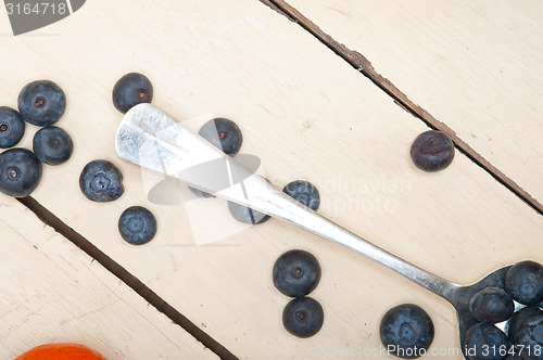 Image of fresh blueberry on silver spoon