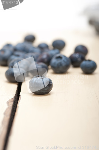 Image of fresh blueberry on white wood table