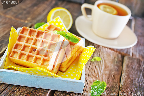 Image of tea with lemon and waffle