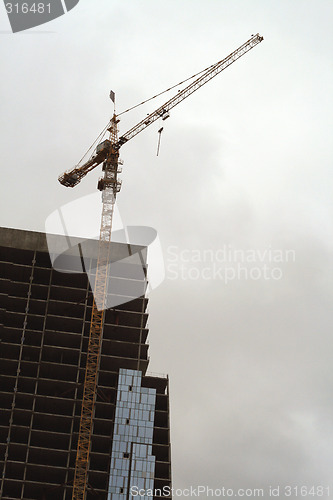 Image of Construction of a tall modern office building.