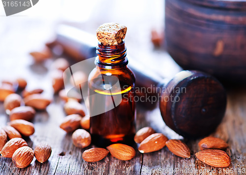 Image of almond oil in a glass bottle