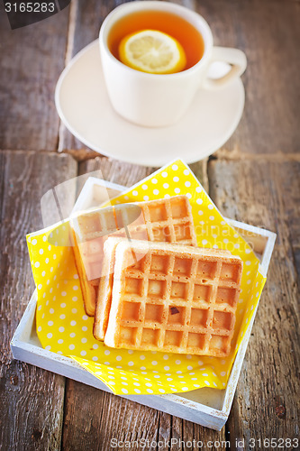 Image of tea with lemon and waffle