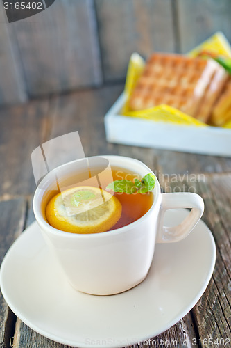 Image of tea with lemon and waffle