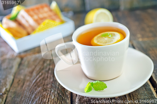 Image of tea with lemon and waffle