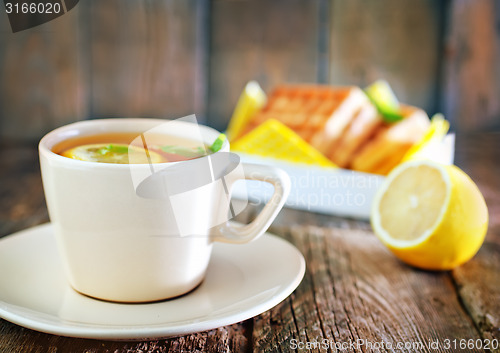 Image of tea with lemon and waffle