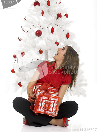 Image of Happy woman with Chirstmas gifts