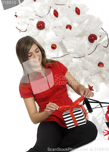 Image of Happy woman with Chirstmas gifts