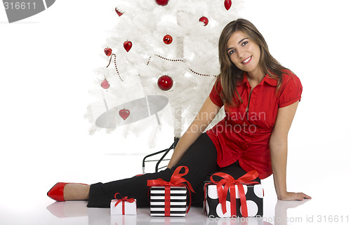 Image of Happy woman with Chirstmas gifts