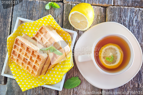 Image of tea with lemon and waffle