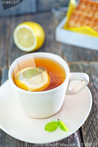 Image of tea with lemon and waffle